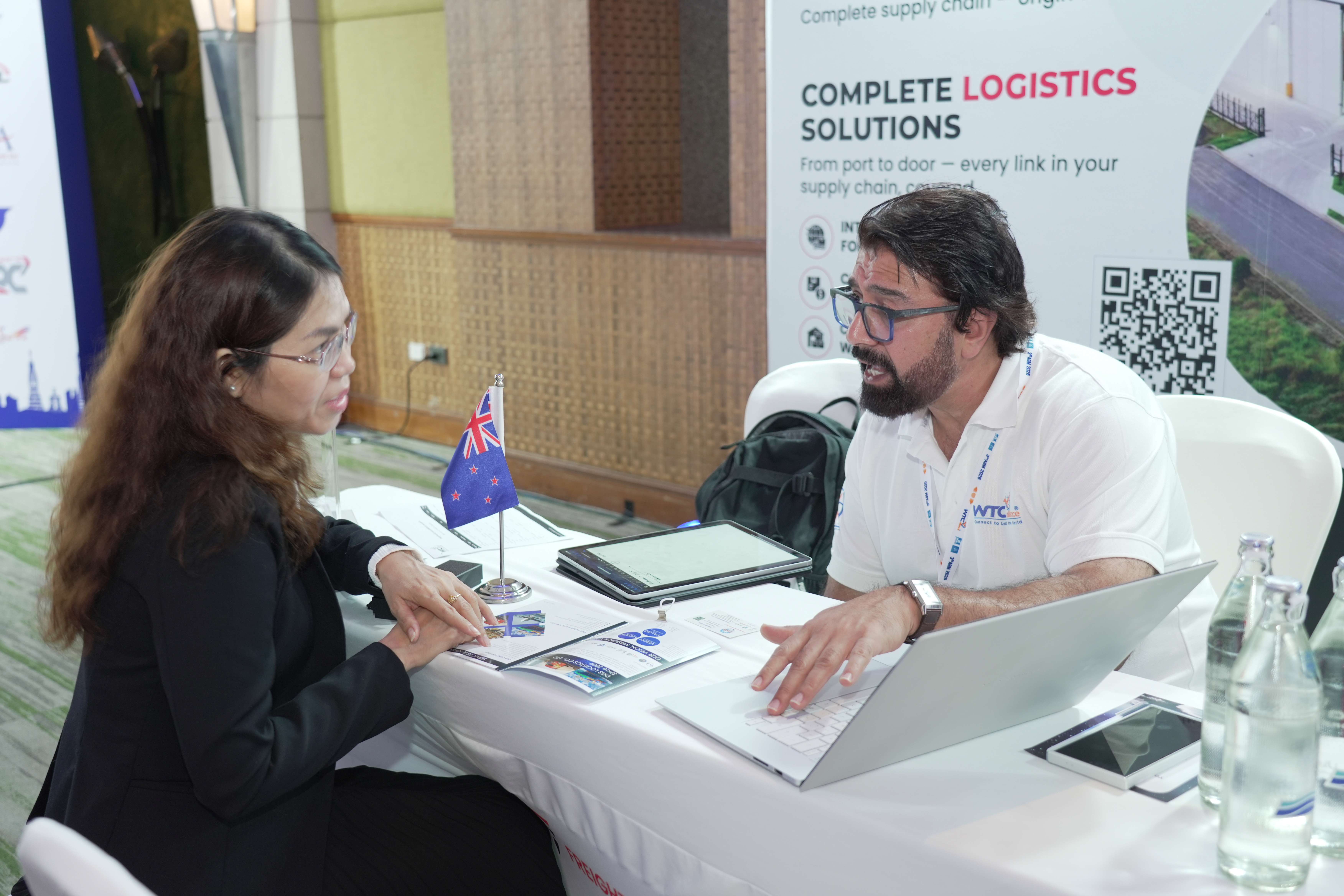 Two freight forwarders discussing at AGM 2026